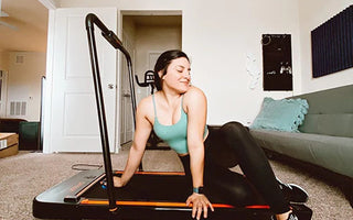 Happy and healthy woman using Urevo Treadmill Walking Pad