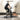 UREVO foldable exercise mat under a stationary bike, providing a non-slip and quiet workout experience, dog relaxing