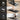 UREVO exercise mat used for exercise bike, treadmill, and yoga; black, foldable, and space-saving design.