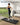 UREVO SpaceWalk E4 walking pad, woman running at home, fitness equipment with the text "Stay Healthy"