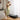 Woman using SpaceWalk 5L Smart Walking Pad in a cozy bedroom, enjoying post-workout relaxation.