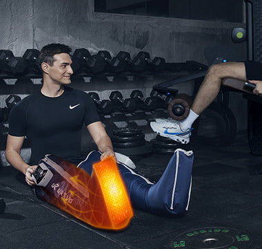  A man in a gym using a UREVO leg compression device.