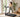 Woman walking on a compact treadmill in a bright home workout space