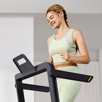 A Woman Practicing On The Urevo Strol Treadmill