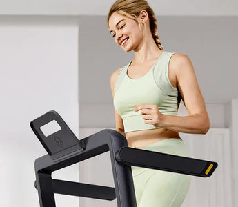 A Woman Practicing On The Urevo Strol Treadmill
