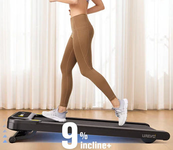 A woman running on a treadmill set at a 9% incline in a room.