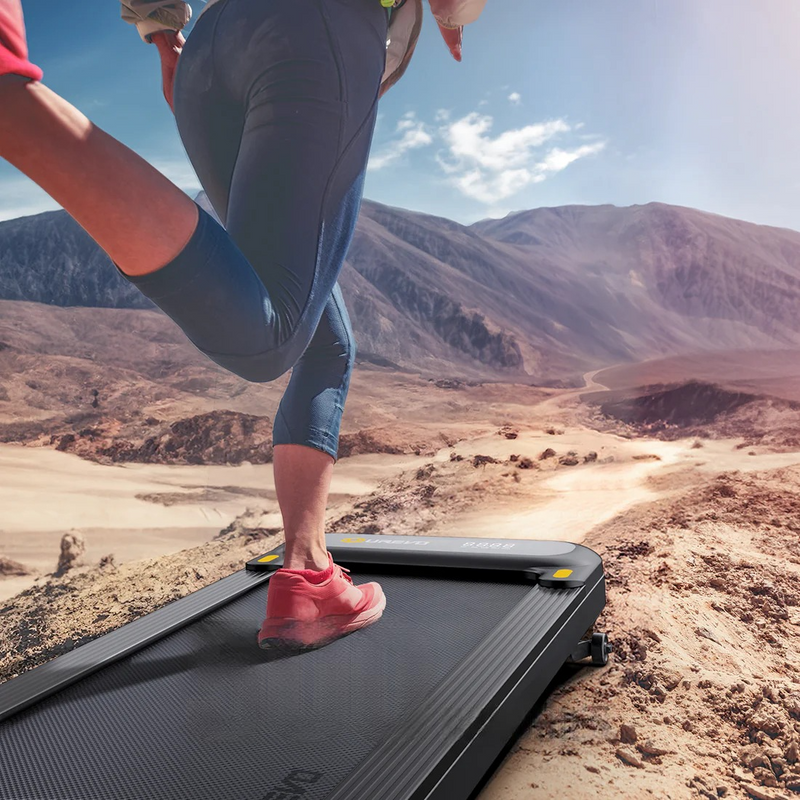 A Person Running on a UREVO SpaceWalk E1L Smart Walking Pad