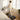 Woman works at standing desk while walking on the UREVO SpaceWalk Lite Walking Pad