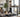 Person using a quiet walking pad in a home office.