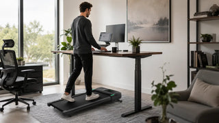 Man walking on an under-desk treadmill while working