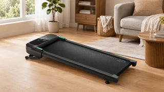 Black walking pad treadmill in a modern living room.