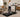 White woman working while walking on a treadmill in a carpeted living room.