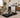 White woman working while walking on a treadmill in a carpeted living room.