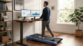 Dad using UREVO under desk walking pad while working from home