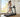 Woman jogging on a treadmill in a bright home workout room