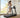 Woman jogging on a treadmill in a bright home workout room
