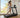 Woman jogs on a treadmill beside sunny home windows