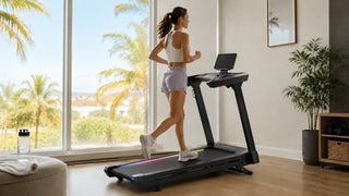 Woman jogs on a treadmill beside sunny home windows