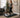 Middle-aged woman uses a walking pad in a home office