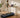 Man walking on a walking pad at a standing desk in a modern home office.