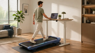 Man walking on a walking pad at a standing desk in a modern home office.
