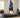 Large-framed man using an urevo incline walking pad in a home gym