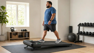 Large-framed man using an urevo incline walking pad in a home gym