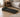 Compact walking pad with digital display in a modern bedroom.