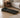 Compact walking pad with digital display in a modern bedroom.