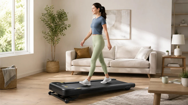 Woman walking on a walking pad in a bright modern living room at home