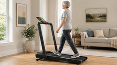 Older woman walking on a UREVO treadmill at home