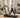 Older woman walking on a UREVO treadmill at home