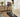 A person is using a treadmill in a living room