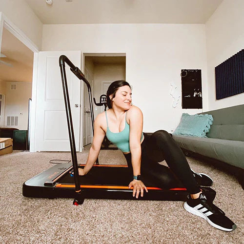 Happy and healthy woman using Urevo Treadmill Walking Pad