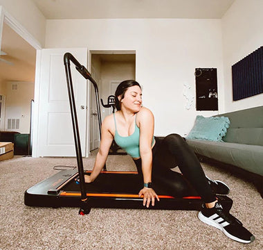 Happy and healthy woman using Urevo Treadmill Walking Pad