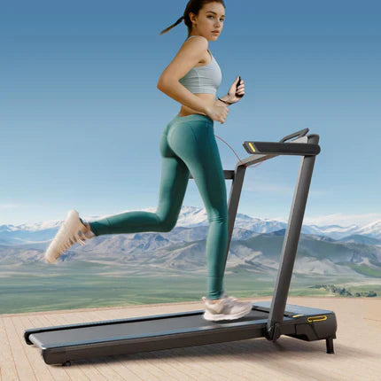 A Woman Running On The Urevo Strol 1 Pro Treadmill