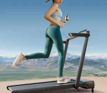 A Woman Running On The Urevo Strol 1 Pro Treadmill