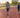Two friends exercising on an outdoor track