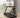 A woman demonstrates easy storage for a compact treadmill.