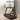 A woman is demonstrating easy storage of a compact treadmill.