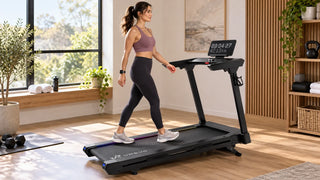 Woman tracking a treadmill walk with a smartwatch