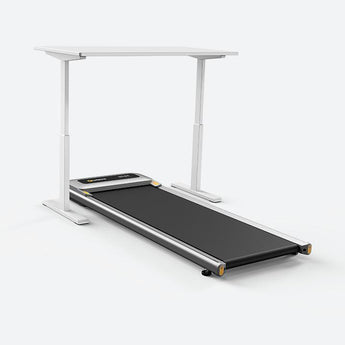 Man seamlessly combines work and fitness with Urevo Under Desk Treadmill - Stay active, stay productive.