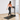 Woman using UREVO Foldi Mini Treadmill, compact and folding design, perfect for home fitness.