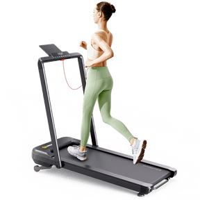 A woman runs on a Strol 2S Pro Treadmill, showcasing its sleek design and comfortable running surface.
