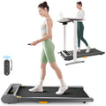 UREVO SpaceWalk Lite walking pad, woman using under desk treadmill, highlighting the remote control and digital display.