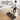 UREVO SpaceWalk E1 under desk treadmill, woman working at a laptop for healthier work habits