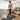 UREVO SpaceWalk E4 walking pad with real-time data display: speed, distance, time, and calories. Woman exercising at home