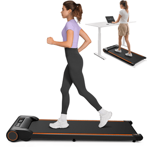 A woman running on a Spacewalk E2 treadmill, demonstrating its use for both jogging and standing desk workouts.