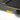 UREVO Strol 2E Smart Treadmill detail: Black running surface, yellow accents, and shock absorption components.